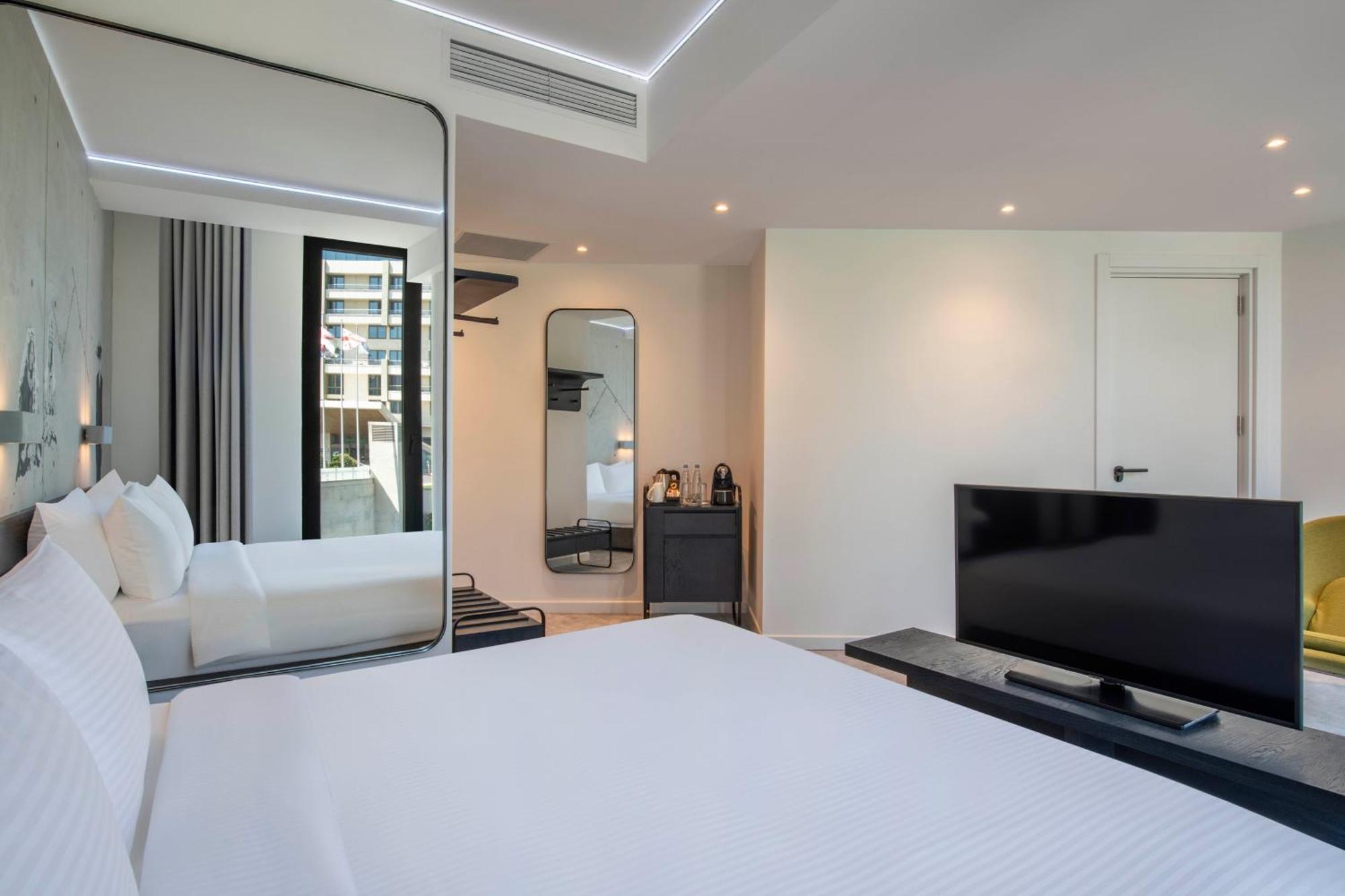 Отель Golden Tulip Design Тбилиси Номер фото